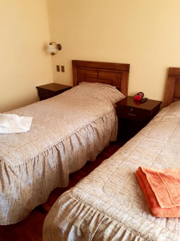 Postel nebo postele na pokoji v ubytování Hostal Nichkito