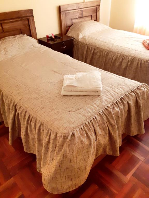 Postel nebo postele na pokoji v ubytování Hostal Nichkito