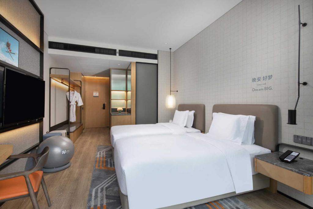 TV a/nebo společenská místnost v ubytování EVEN Hotel Shenzhen Nanshan by IHG
