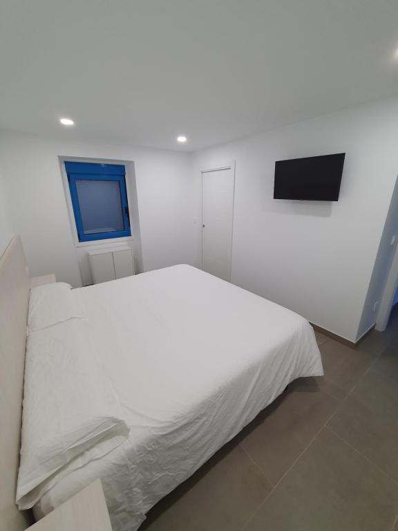 A bed or beds in a room at A Casa do Lado