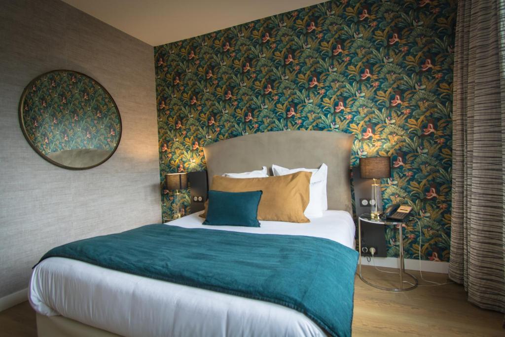 Postel nebo postele na pokoji v ubytování Hôtel Restaurant Vaillant proche Europapark Rulantica