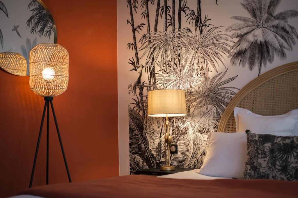 Postel nebo postele na pokoji v ubytování Hôtel Restaurant Vaillant proche Europapark Rulantica