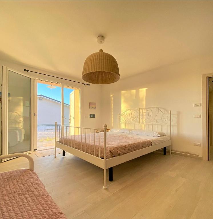 Postel nebo postele na pokoji v ubytování Agriturismo Tre di Spade