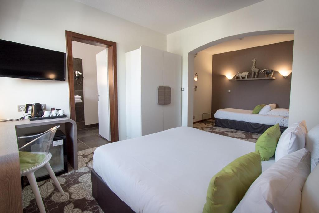 Postel nebo postele na pokoji v ubytování Hôtel Restaurant Vaillant proche Europapark Rulantica