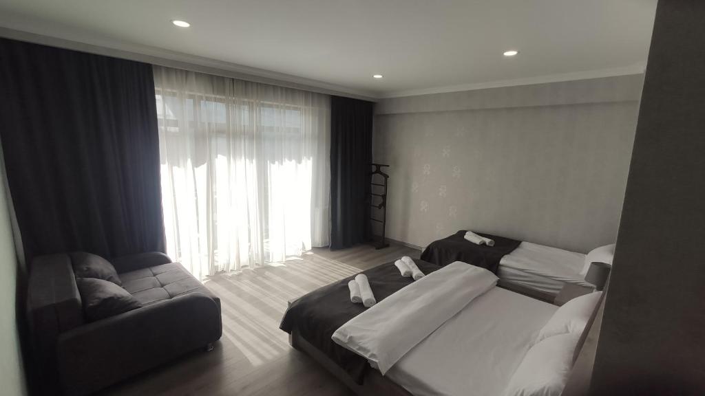 Postel nebo postele na pokoji v ubytování Prime Hotel Kazbegi