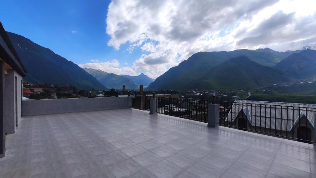 a balcony with a view of the mountains at Prime Hotel Kazbegi in Kazbegi