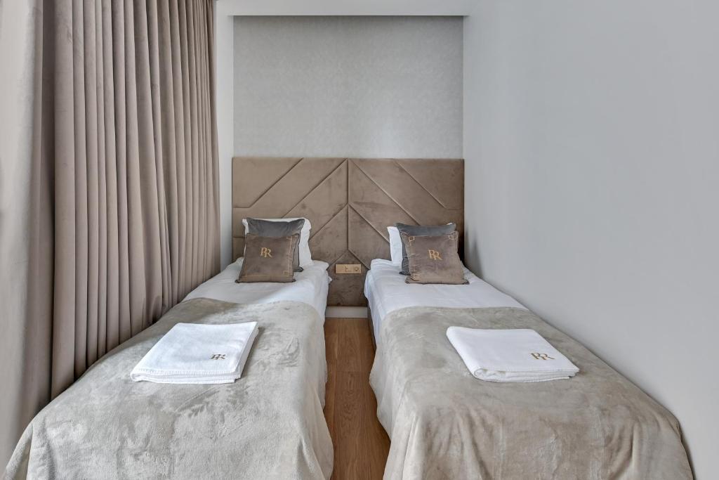 Posteľ alebo postele v izbe v ubytovaní Granaria RR DeLuxe Apartment Old Town