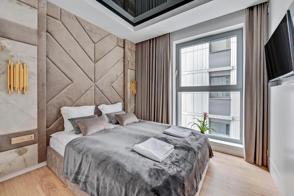 Posteľ alebo postele v izbe v ubytovaní Granaria RR DeLuxe Apartment Old Town
