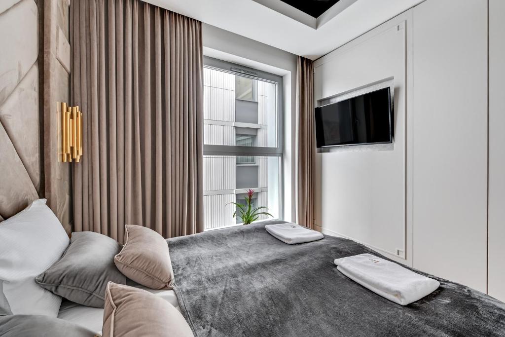 Posteľ alebo postele v izbe v ubytovaní Granaria RR DeLuxe Apartment Old Town