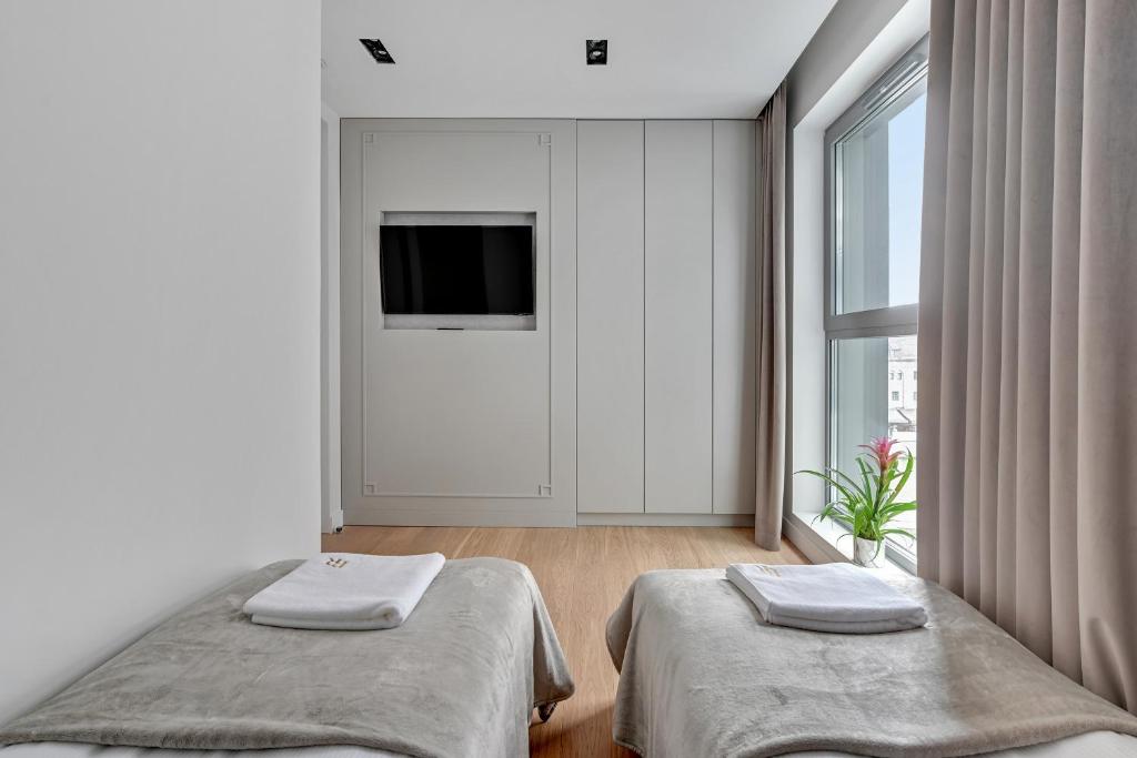 Posteľ alebo postele v izbe v ubytovaní Granaria RR DeLuxe Apartment Old Town