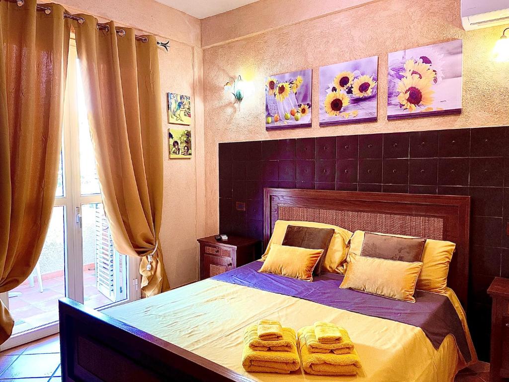 מיטה או מיטות בחדר ב-La Collina sul Mare