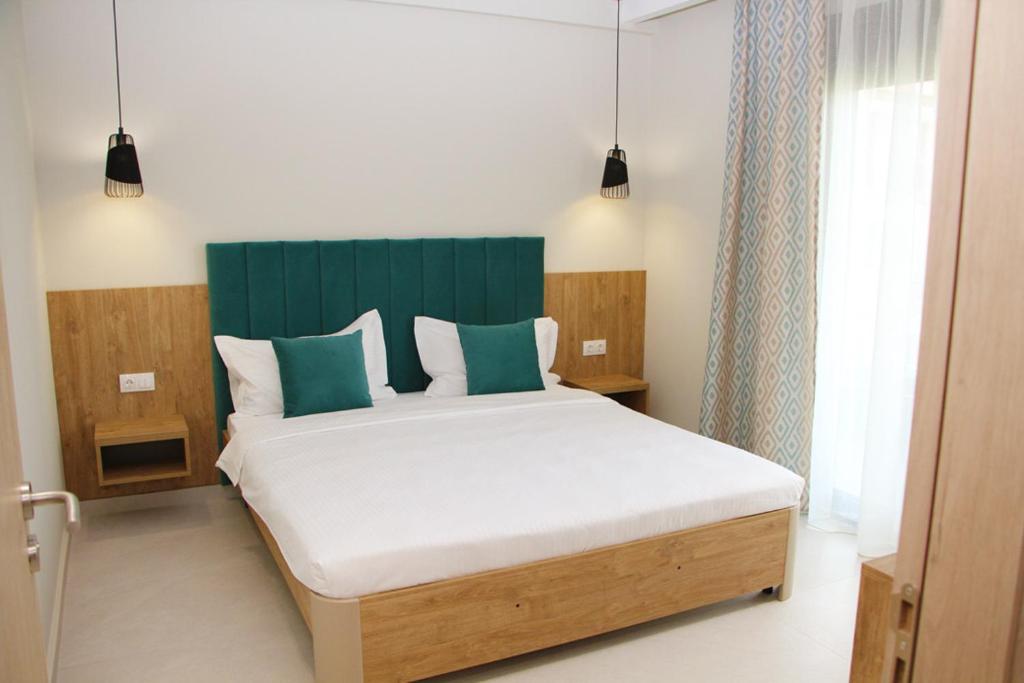Postel nebo postele na pokoji v ubytování Oliva Suites