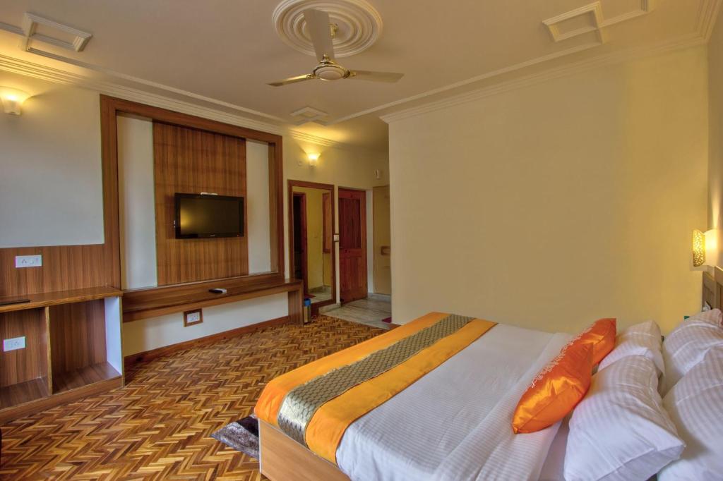 Postel nebo postele na pokoji v ubytování Woodstock Inn Manali