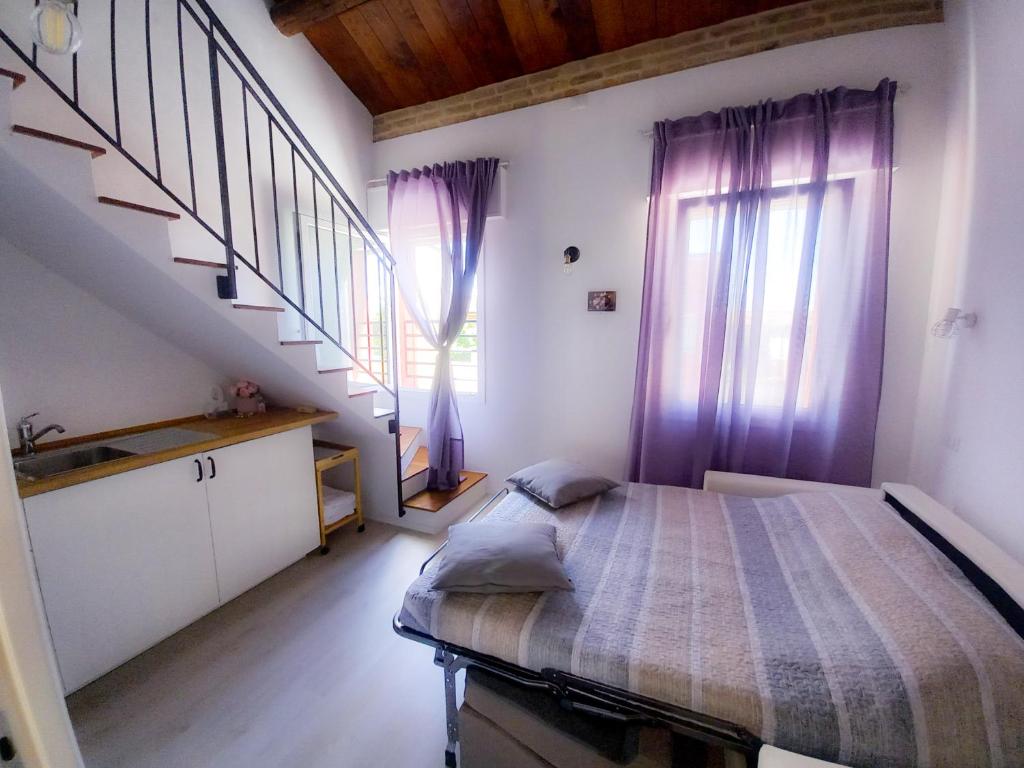 Postel nebo postele na pokoji v ubytování Appartamenti Monte Selce
