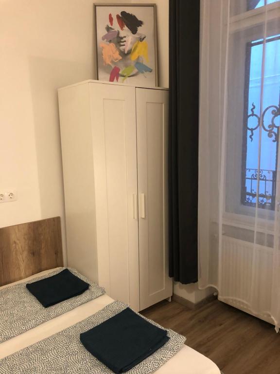 Postel nebo postele na pokoji v ubytování Omega Apartments Budapest