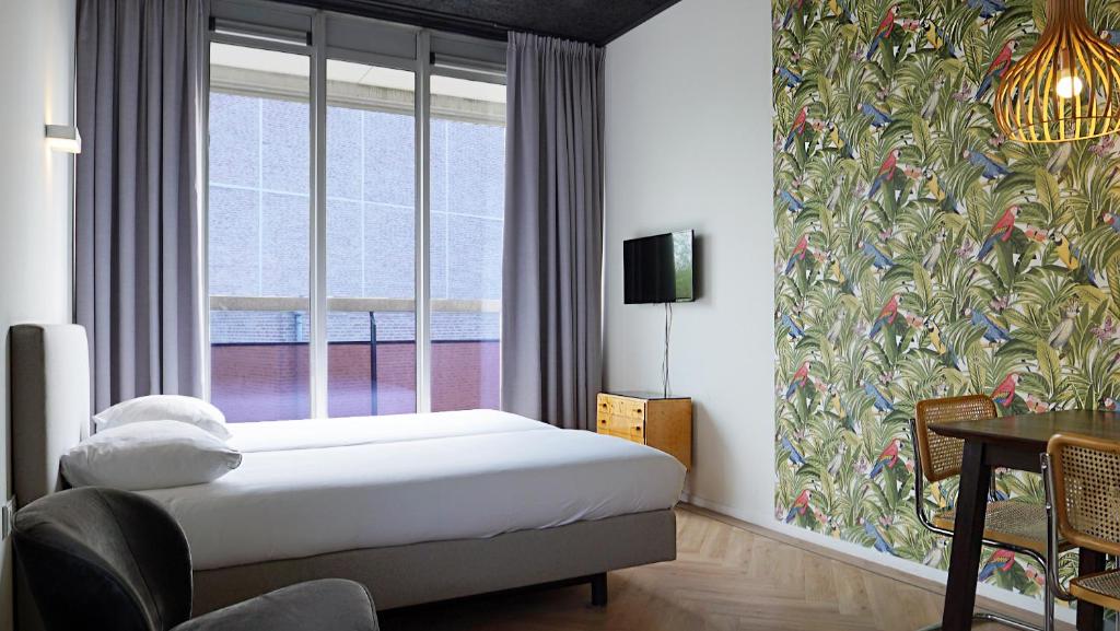 Postel nebo postele na pokoji v ubytování Guesthouse Vertoef