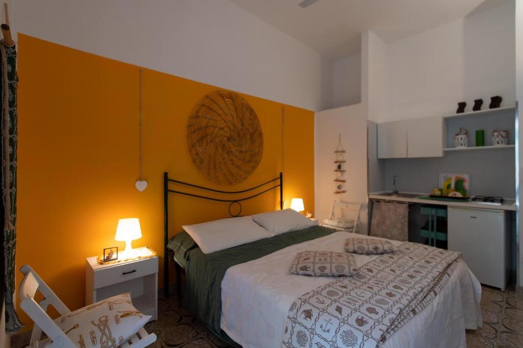 A bed or beds in a room at Gariga Holidays Apartments