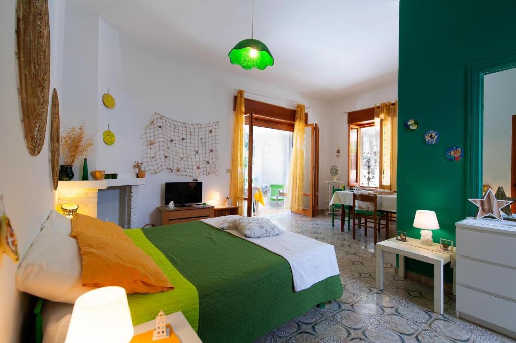 A bed or beds in a room at Gariga Holidays Apartments