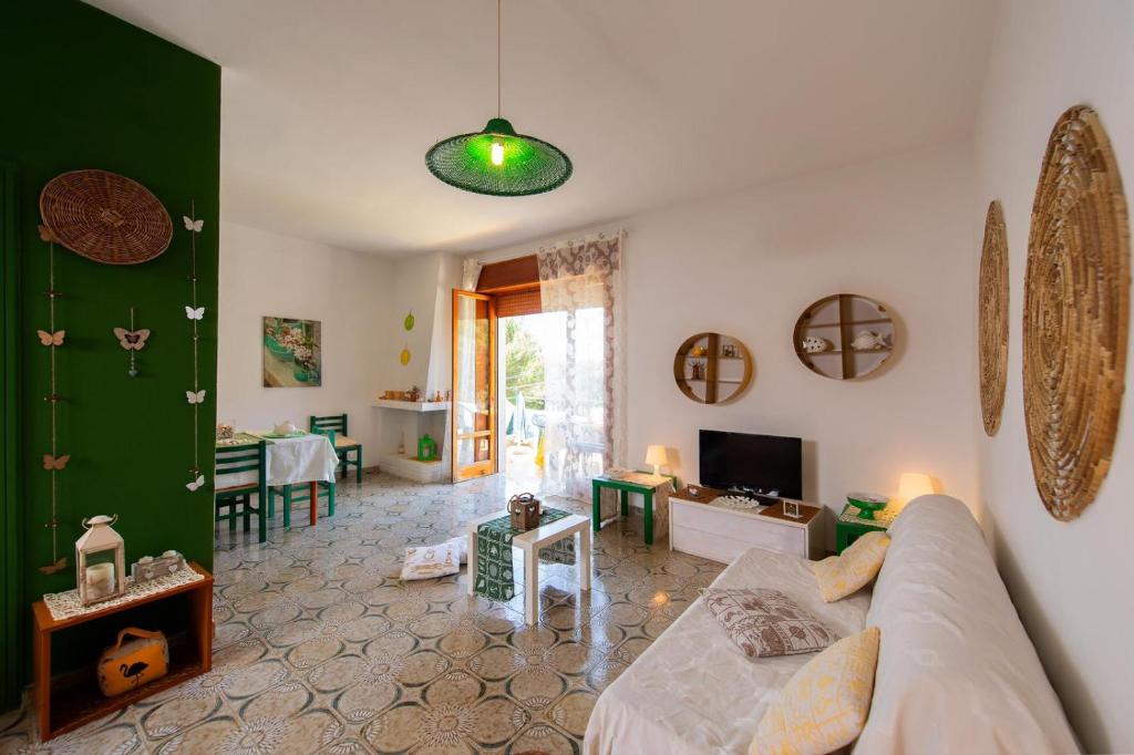 A bed or beds in a room at Gariga Holidays Apartments