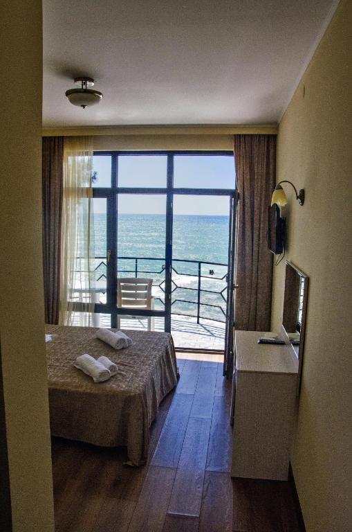 Postel nebo postele na pokoji v ubytování Hotel Medusa
