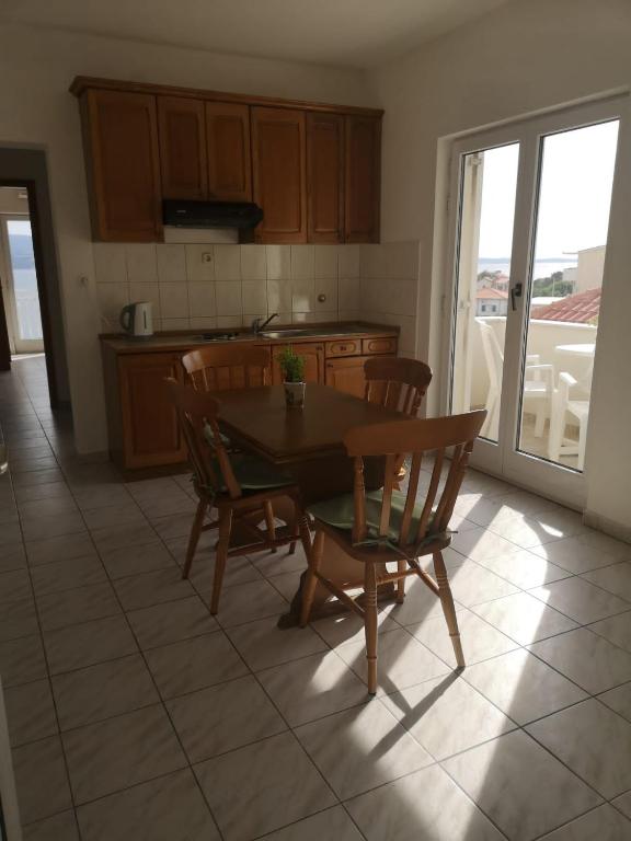 Kuchyň nebo kuchyňský kout v ubytování Anic Apartments Stanići