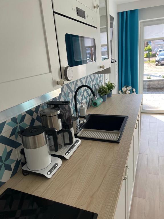Kuchnia lub aneks kuchenny w obiekcie Apartament Baltic A8 Pobierowo