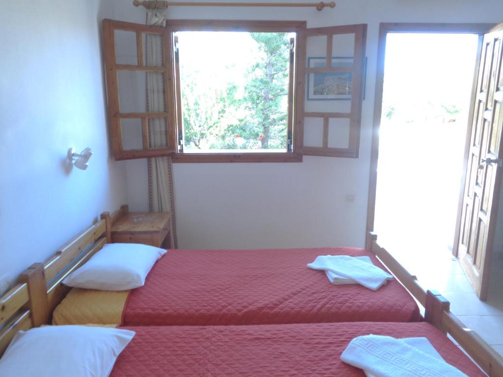 Postel nebo postele na pokoji v ubytování LITHI
