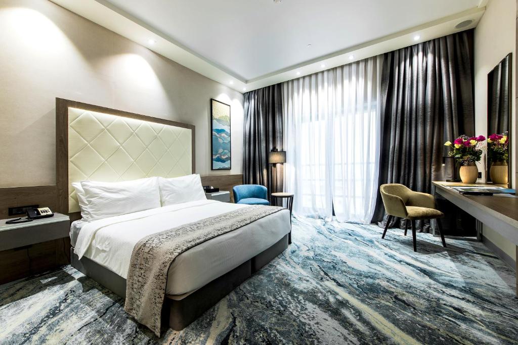 Postel nebo postele na pokoji v ubytování Rixos Turkistan