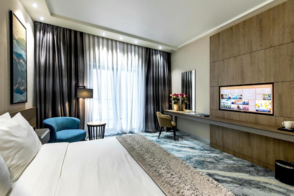 TV a/nebo společenská místnost v ubytování Rixos Turkistan