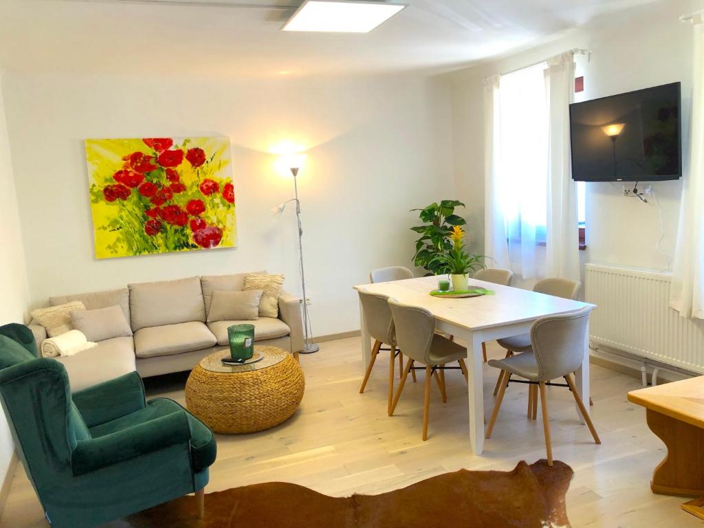 a living room with a couch and a table at Gästeapartments Rossatz in Rossatz