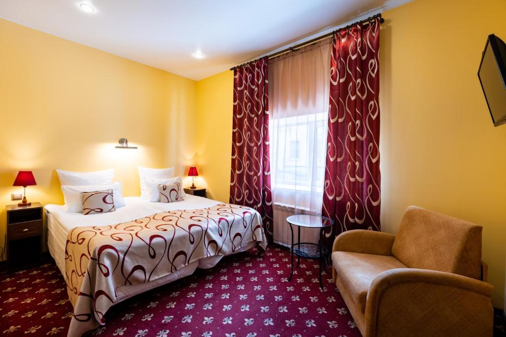 Postel nebo postele na pokoji v ubytování Jenavi Club Hotel
