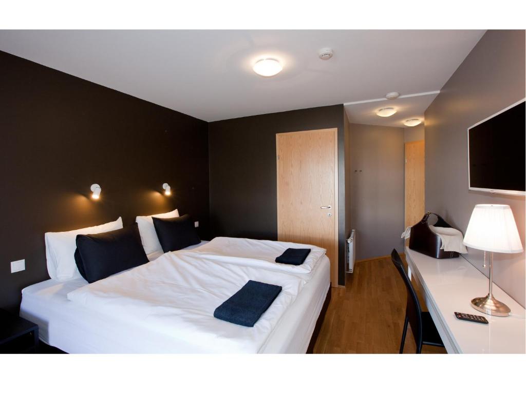 Postel nebo postele na pokoji v ubytování Torg Guest House