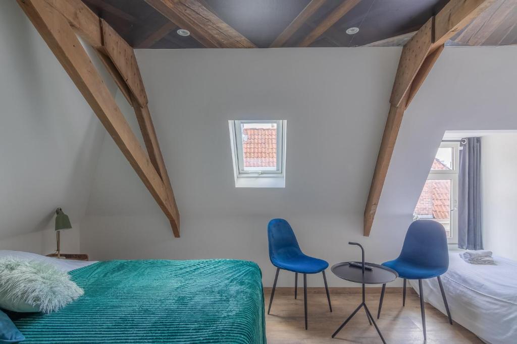 Postel nebo postele na pokoji v ubytování Hotel Café Restaurant 't Raedhûs
