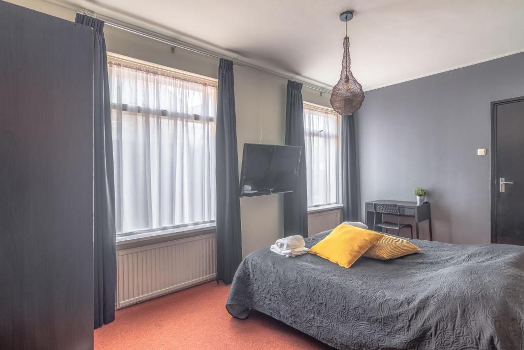 Postel nebo postele na pokoji v ubytování Hotel Café Restaurant 't Raedhûs