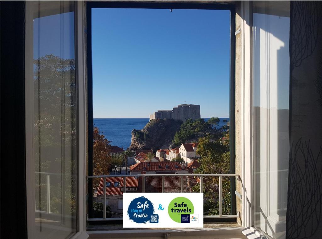 a window with a view of the ocean at Villa Ani apartment Ariel in Dubrovnik