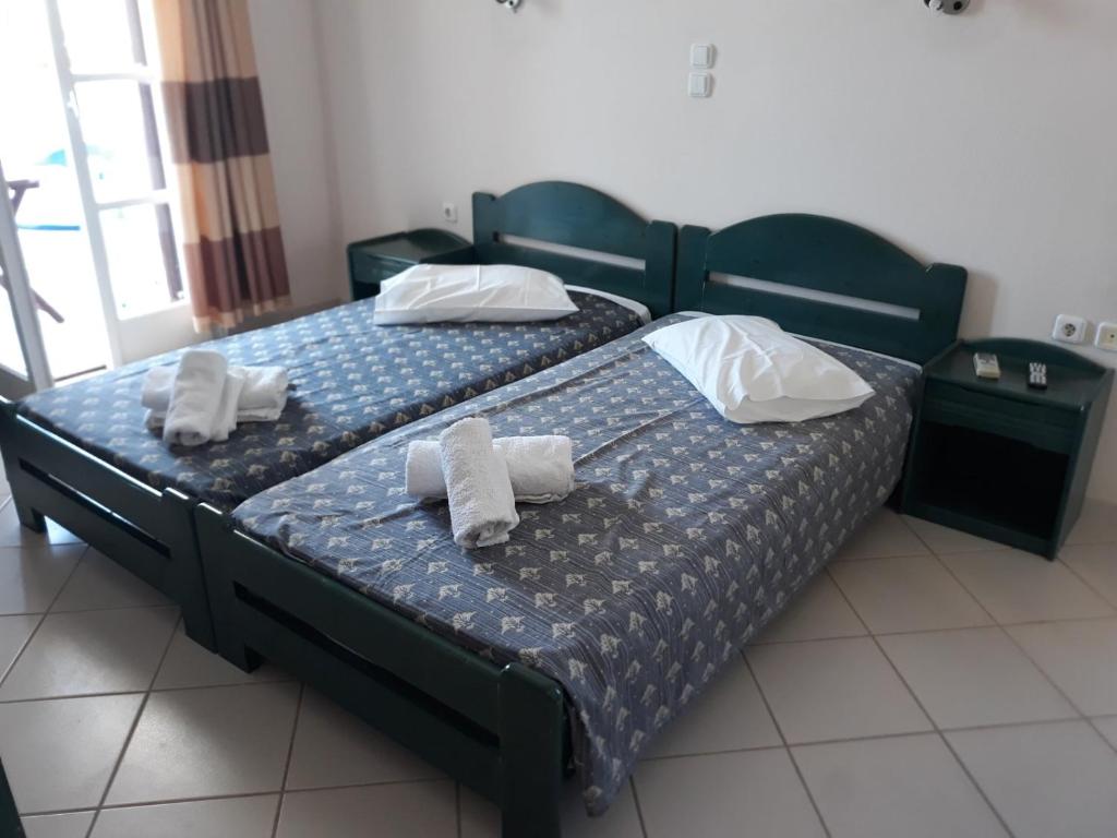 Postel nebo postele na pokoji v ubytování Joanna's Rooms on the Beach