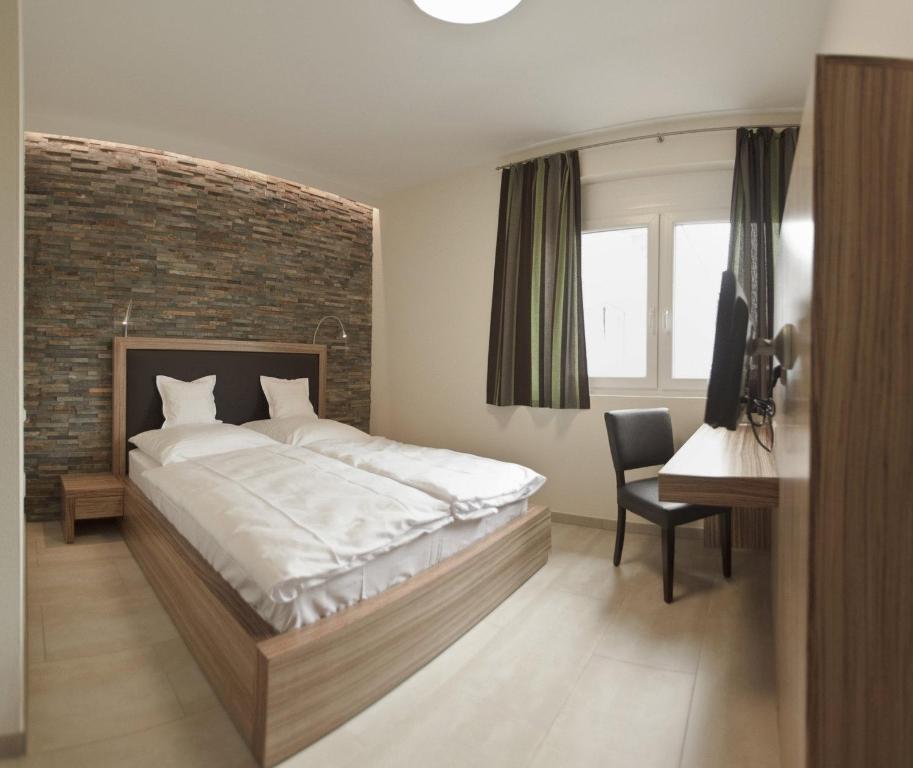 Postel nebo postele na pokoji v ubytování Hotel Maxis - digitaler Self-check-in -