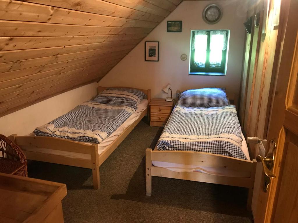 Postel nebo postele na pokoji v ubytování Chalupa Paseky