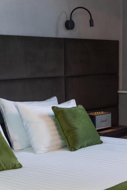 Postel nebo postele na pokoji v ubytování BRYK Hotel - Maestro