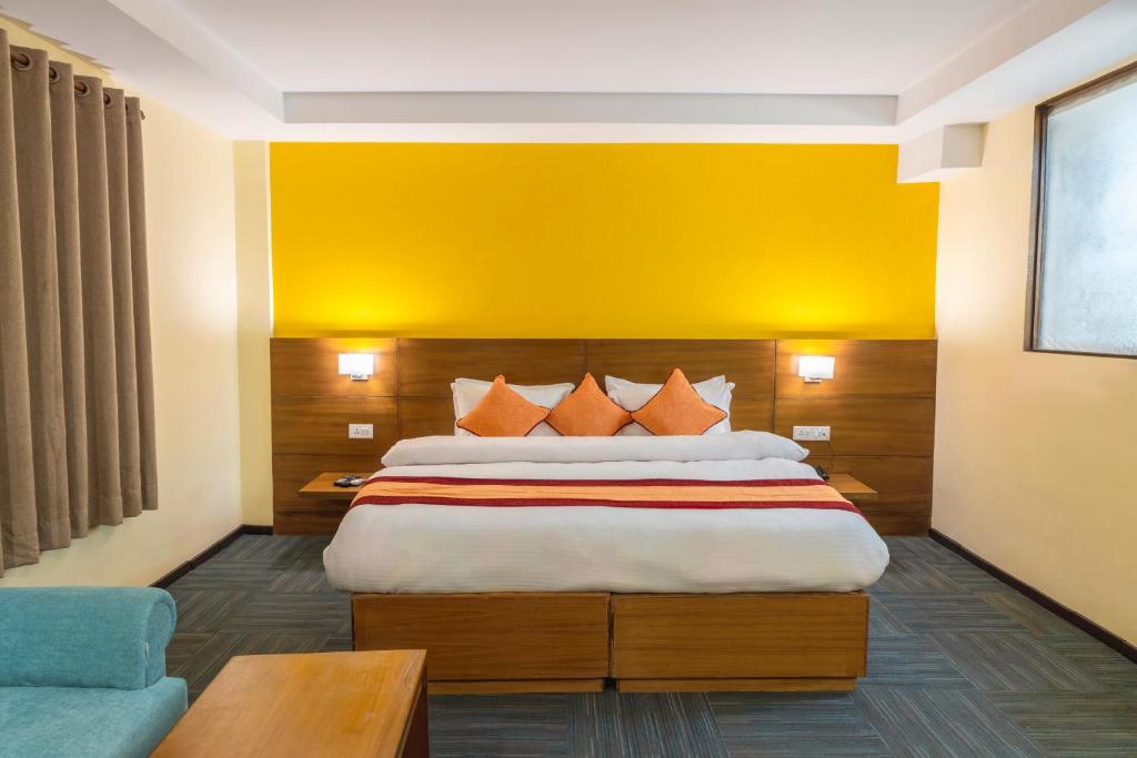 Voodi või voodid majutusasutuse Hotel Ananda Pashupati toas