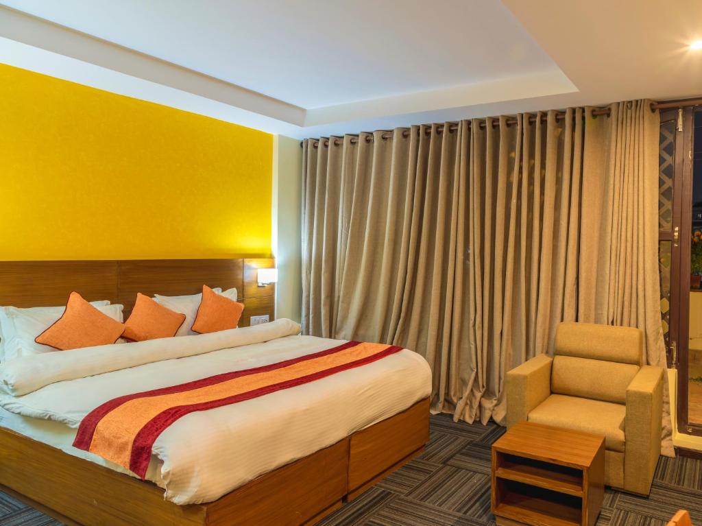 Voodi või voodid majutusasutuse Hotel Ananda Pashupati toas
