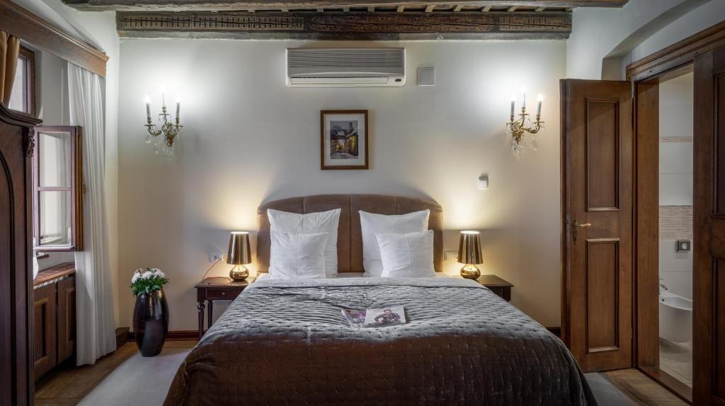 Postel nebo postele na pokoji v ubytování Hotel Aurus by Adrez