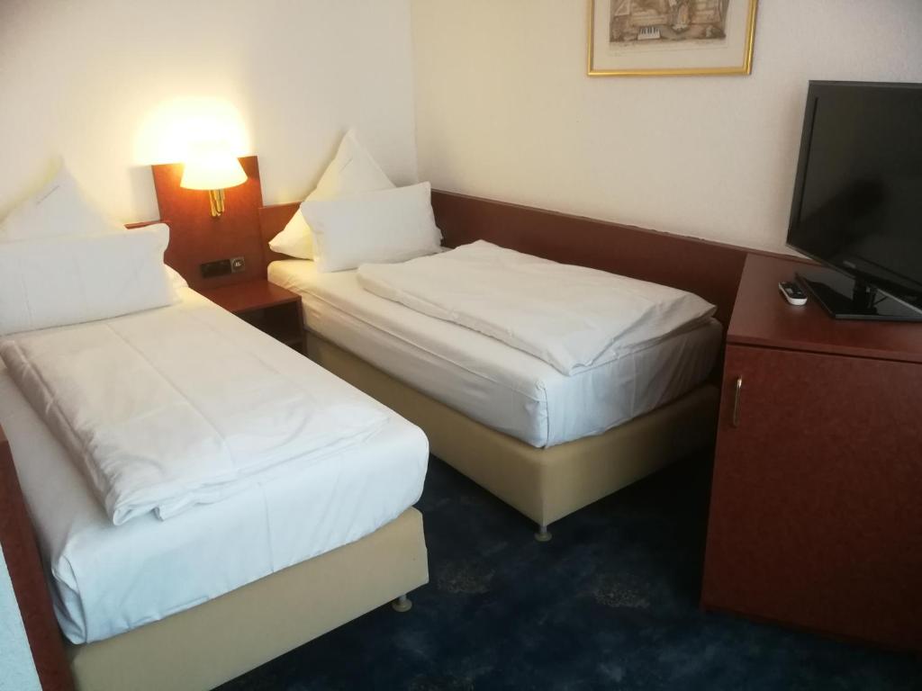 Postel nebo postele na pokoji v ubytování Hotel An der Philharmonie