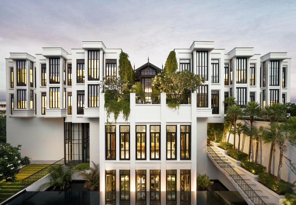 an architectural rendering of a white building with windows at The Siam in Bangkok