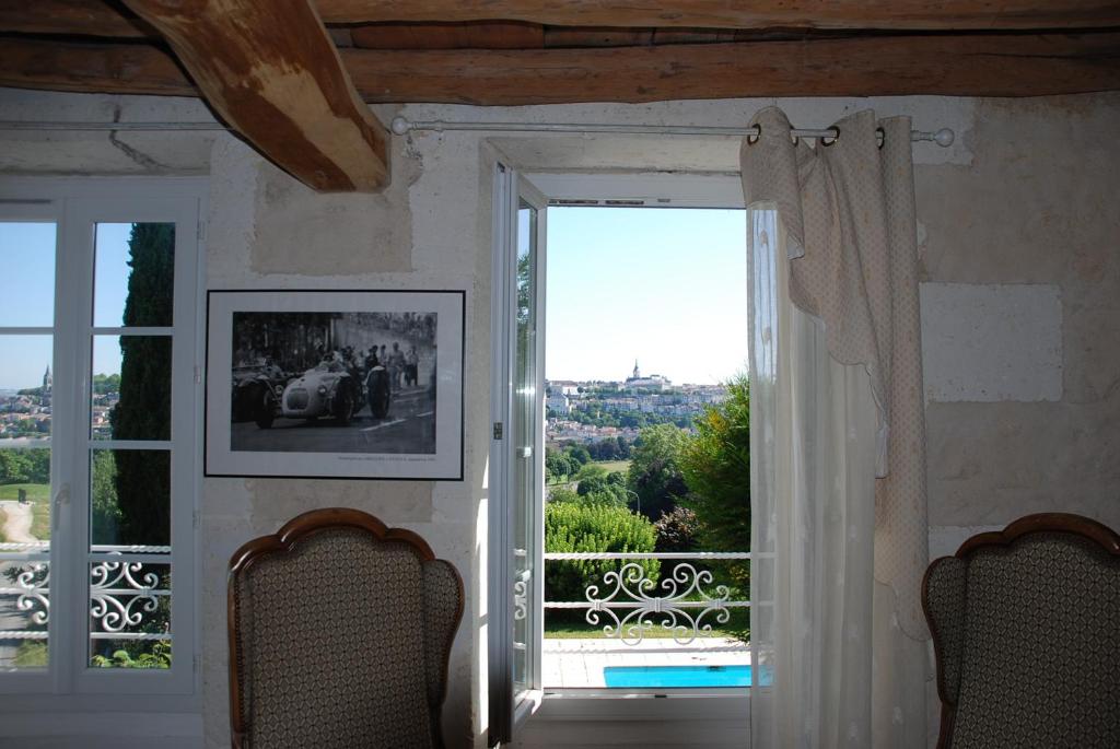 a room with a large window with a view at Champ Fleuri in Angoulême