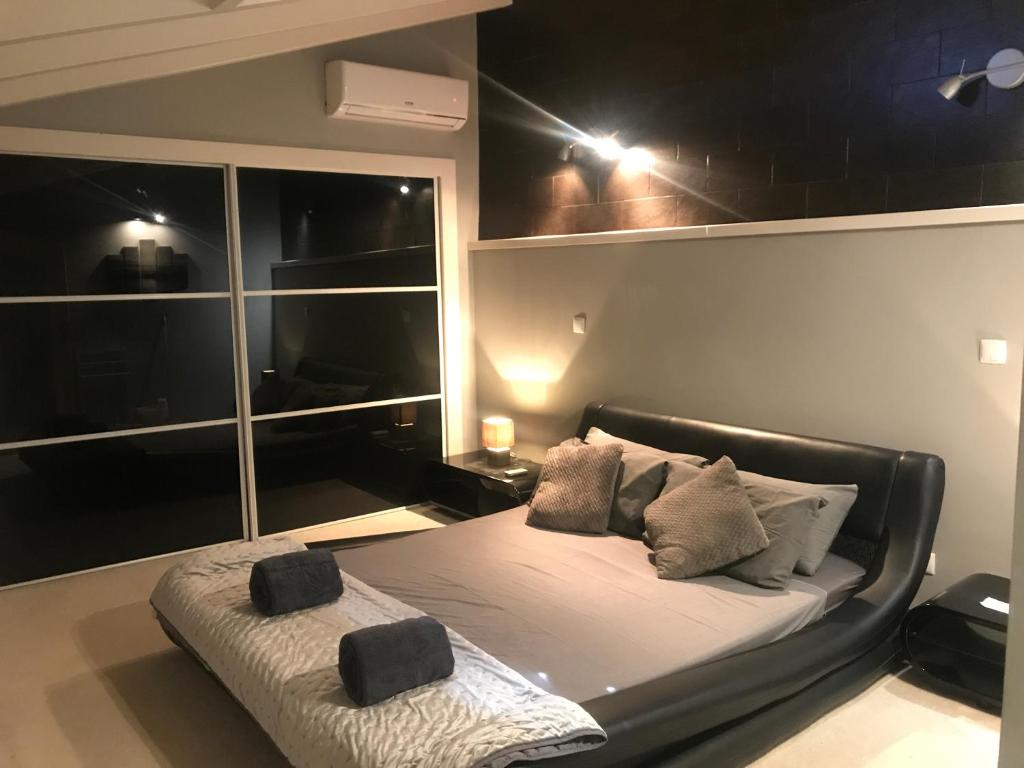 a bedroom with a bed and a nightstand at casa 42 in Barão de São João