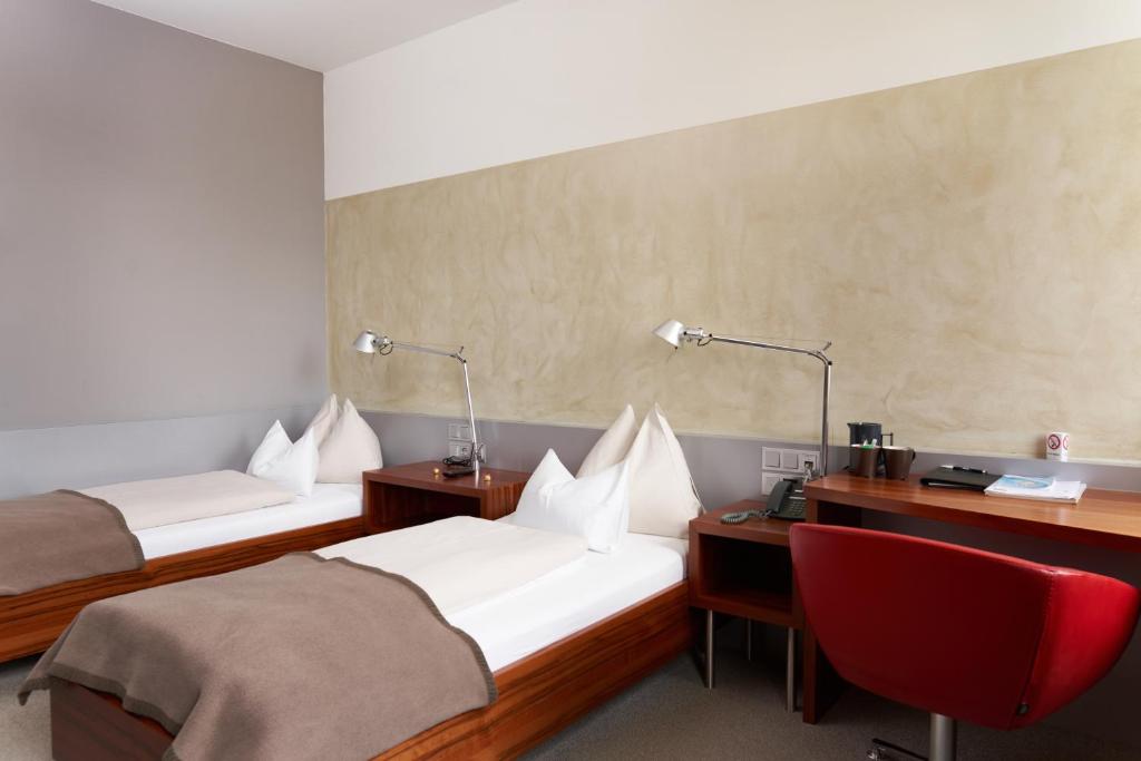 Postel nebo postele na pokoji v ubytování Hotel Maxlhaid