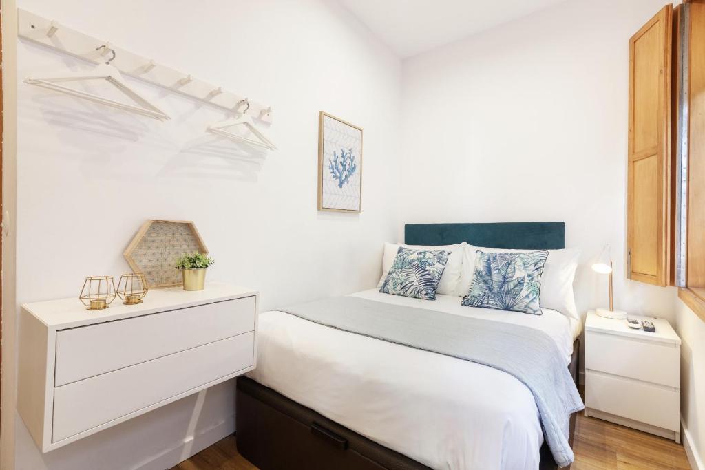 Ένα ή περισσότερα κρεβάτια σε δωμάτιο στο D&S - Porto São Bento Apartments