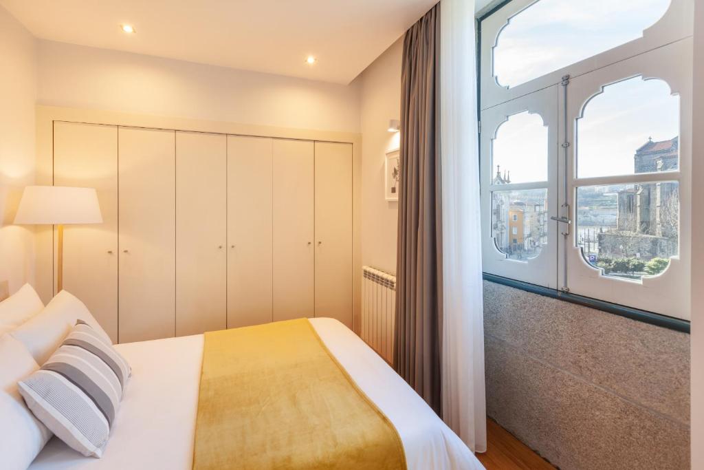 Postel nebo postele na pokoji v ubytování D&S - Ribeira Premium Apartments
