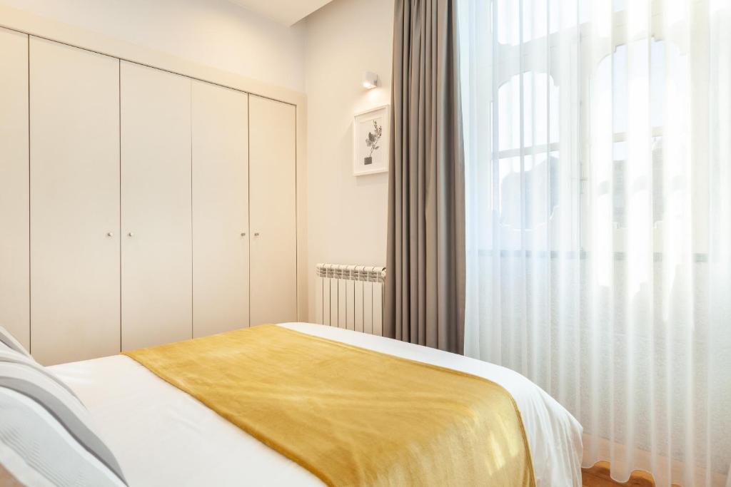 Postel nebo postele na pokoji v ubytování D&S - Ribeira Premium Apartments